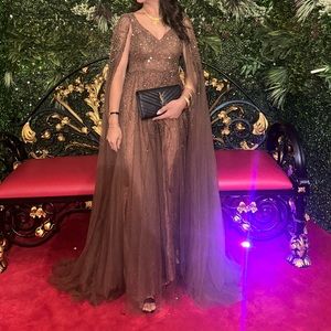 Beaded down gown with cape sleeves